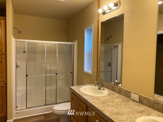 156 Nelson Road Winlock, WA 98596 - Photo 9 of 19 a bathroom with a granite countertop sink toilet and shower