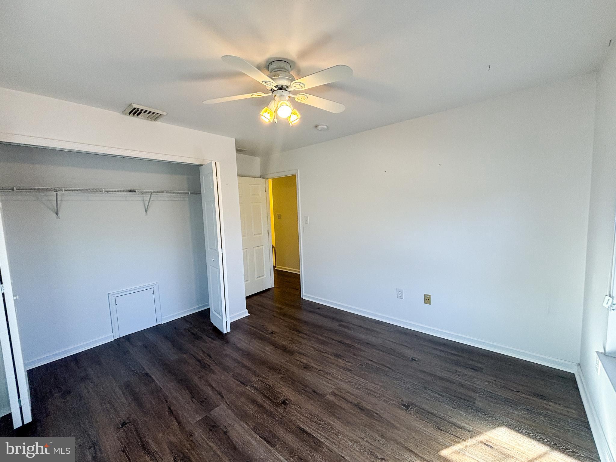 1071 Chanticleer Cherry Hill, NJ 08003 - Photo 12 of 18 an empty room with wooden floor and windows