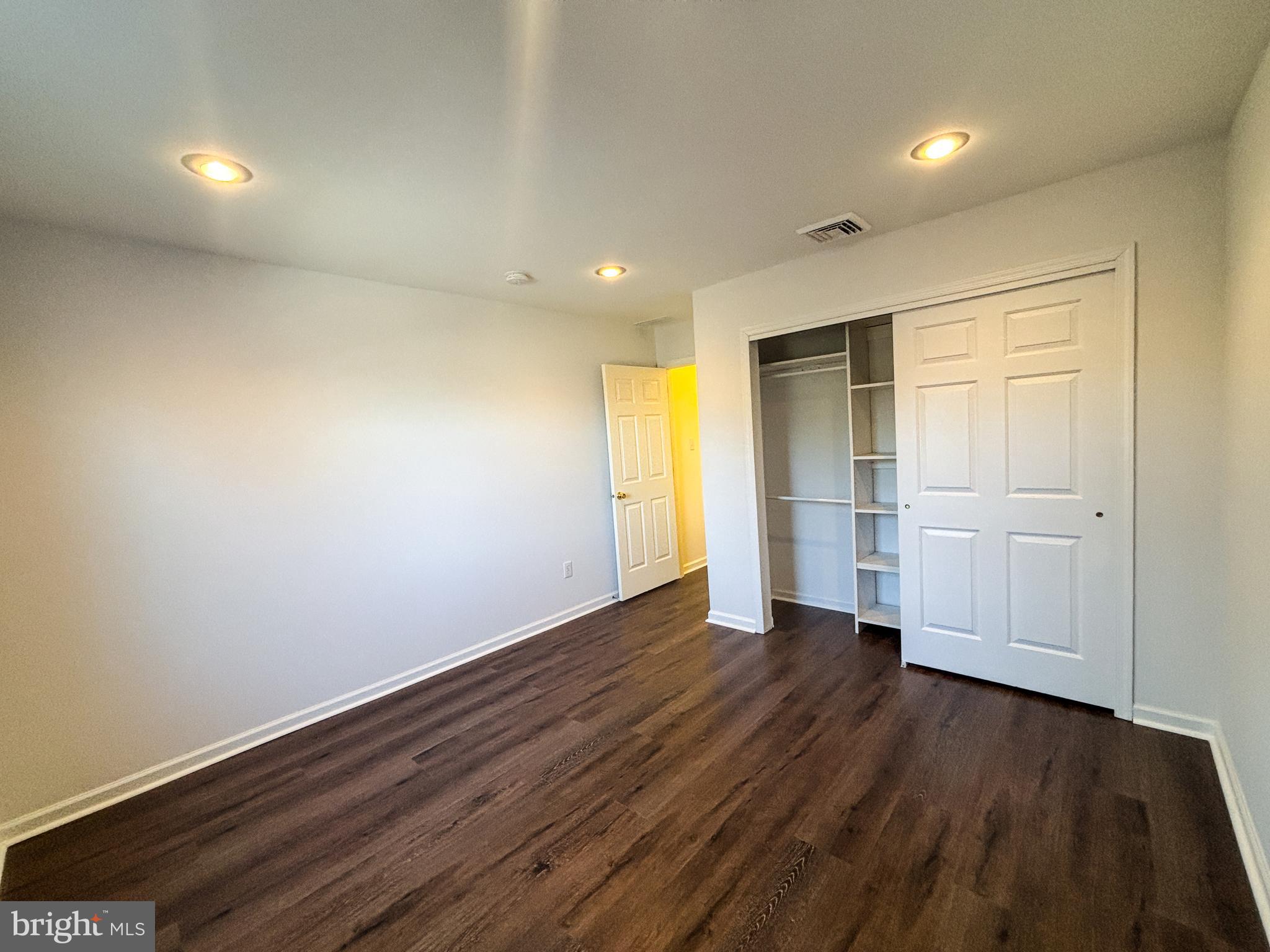 1071 Chanticleer Cherry Hill, NJ 08003 - Photo 13 of 18 a view of an empty room with wooden floor closet and windows