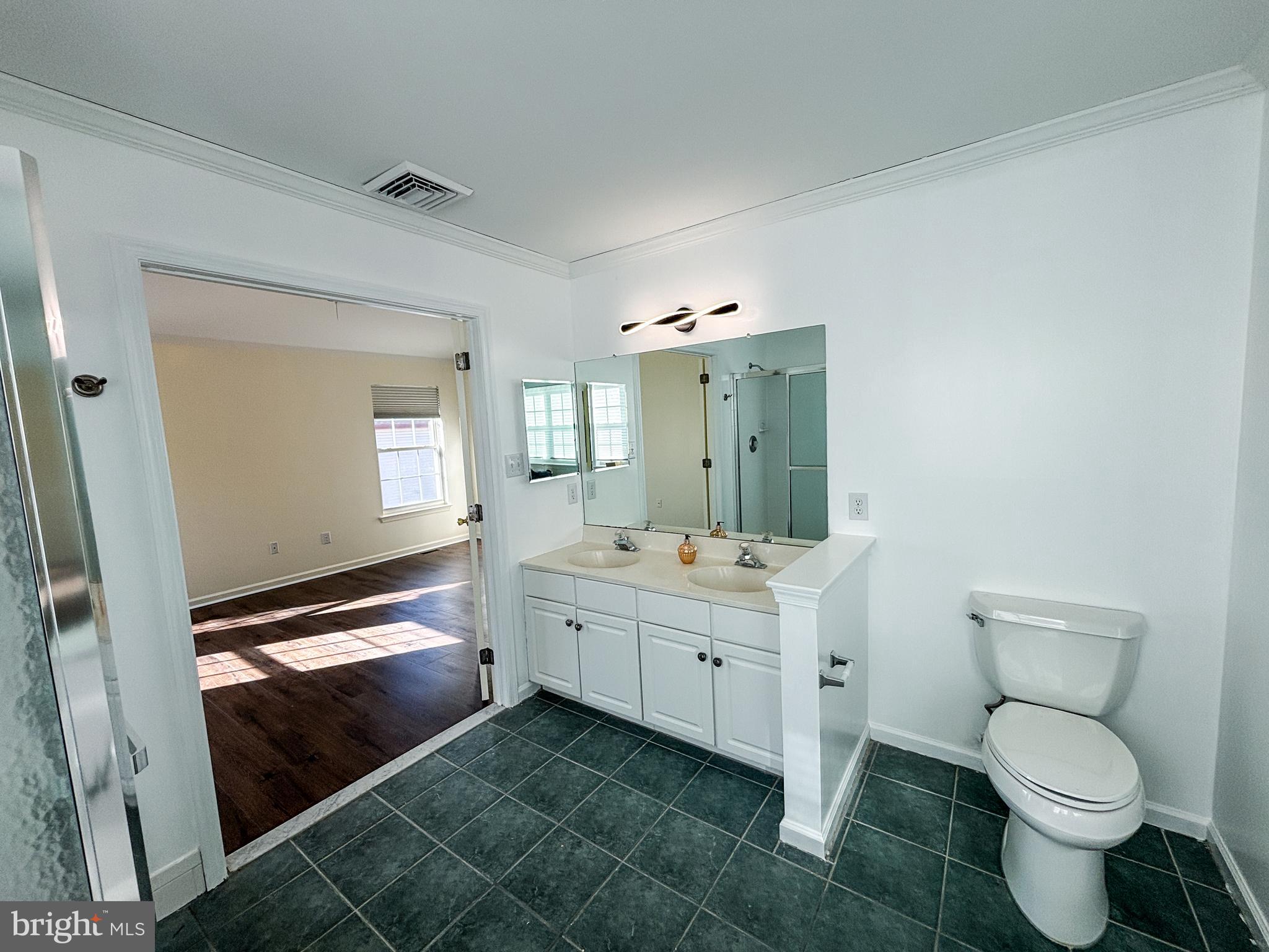 1071 Chanticleer Cherry Hill, NJ 08003 - Photo 9 of 18 a bathroom with a toilet sink and mirror