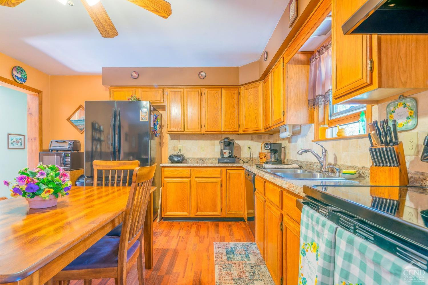 1831 Sleepy Hollow Road, Unit VV50 Athens, NY 12015 - Photo 12 of 42 a view of a kitchen with kitchen island a large window and a sink