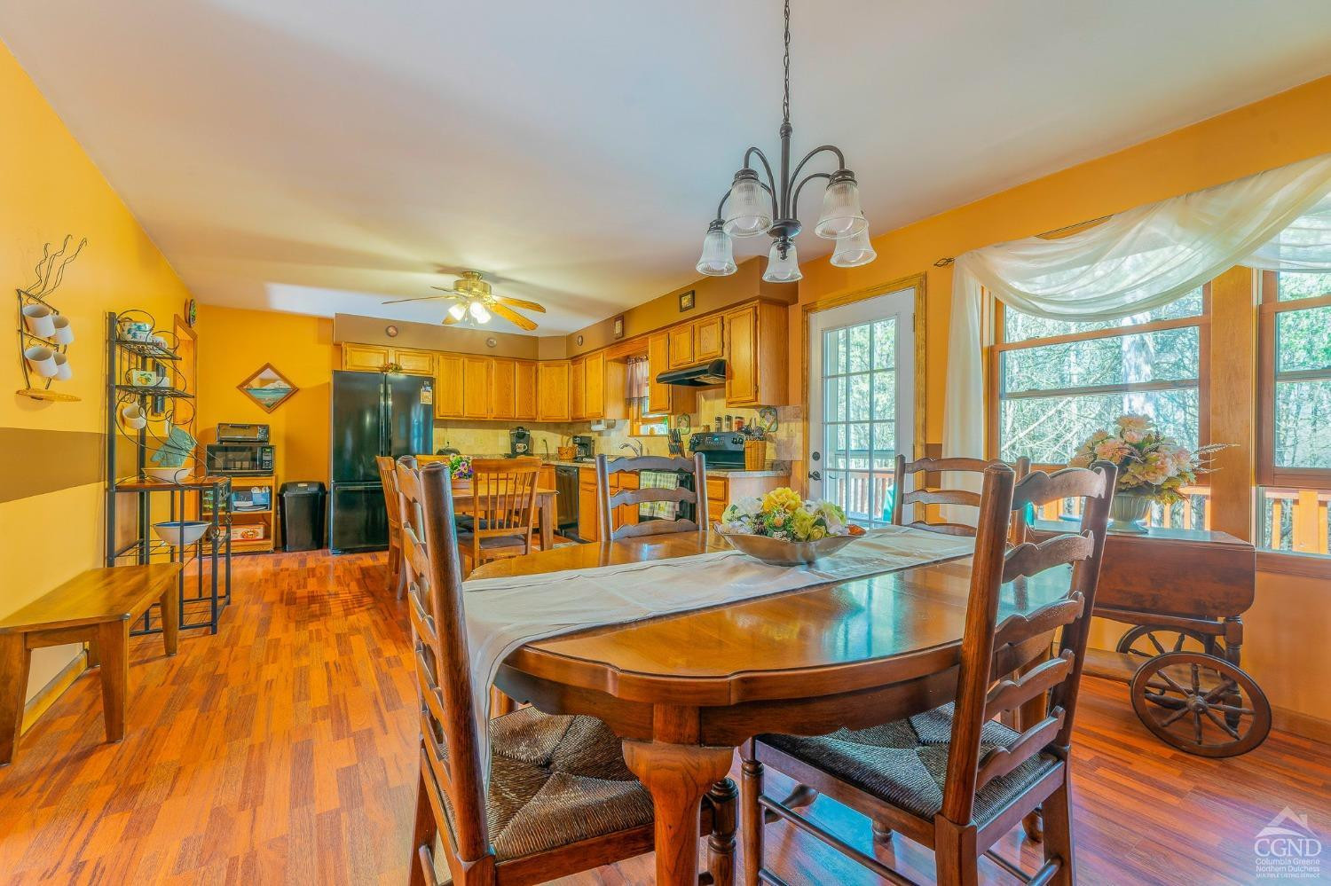 1831 Sleepy Hollow Road, Unit VV50 Athens, NY 12015 - Photo 15 of 42 a dining room with furniture and wooden floor