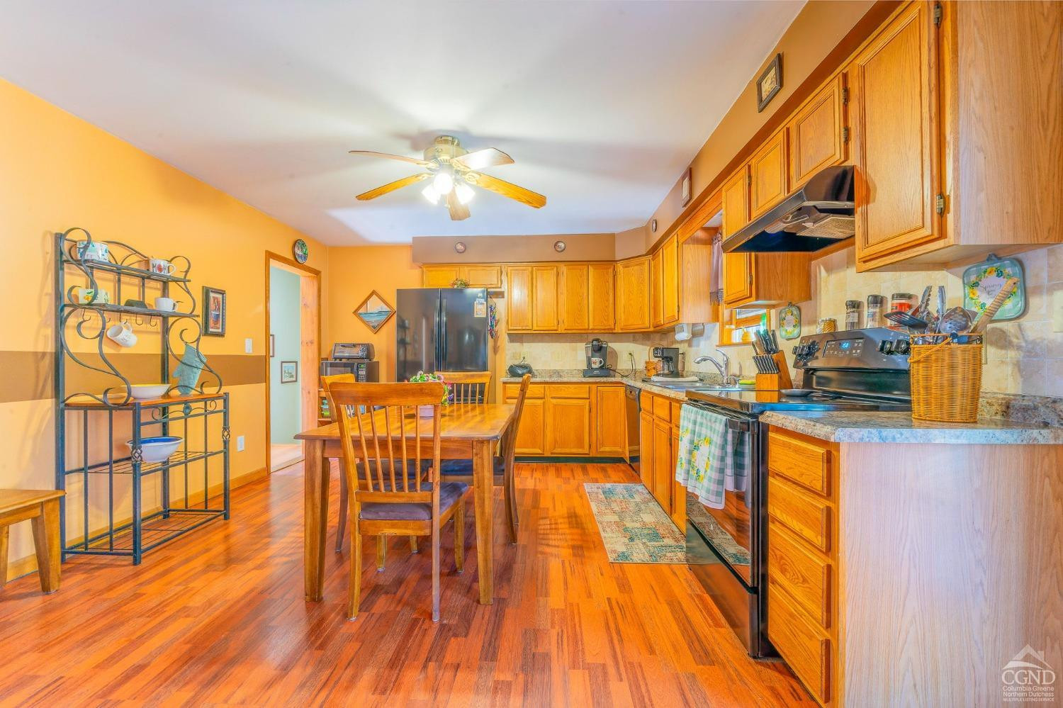 1831 Sleepy Hollow Road, Unit VV50 Athens, NY 12015 - Photo 17 of 42 a view of a dining room with furniture and wooden floor