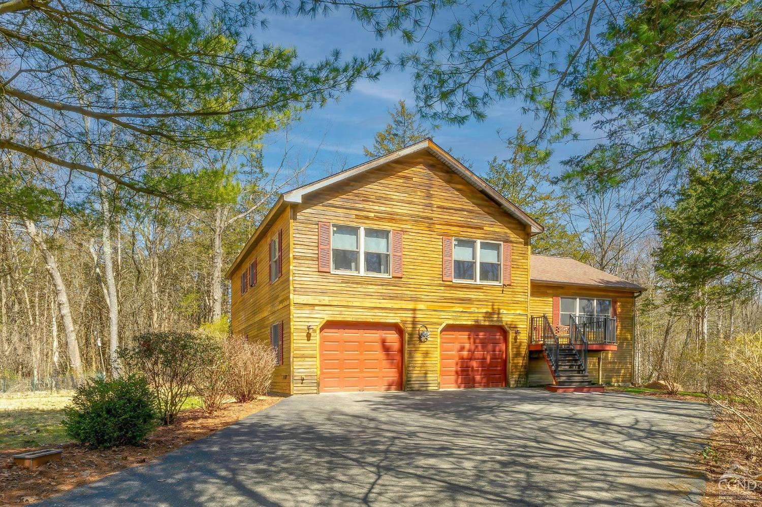 1831 Sleepy Hollow Road, Unit VV50 Athens, NY 12015 - Photo 2 of 42 a front view of a house with a yard