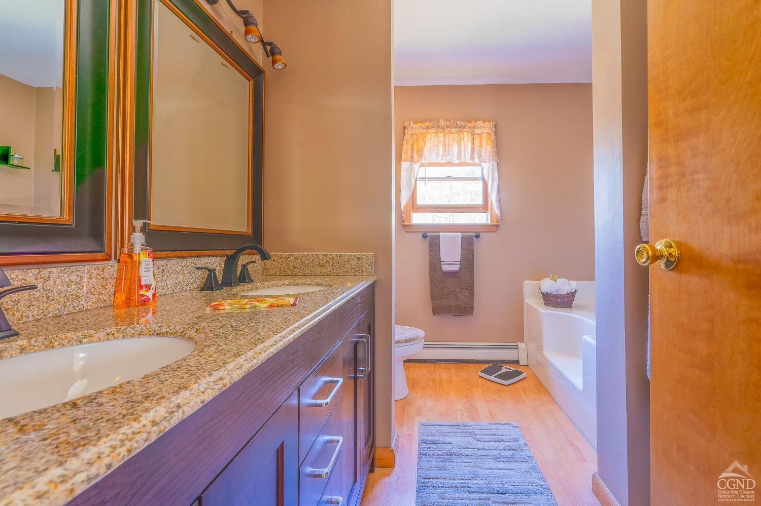 1831 Sleepy Hollow Road, Unit VV50 Athens, NY 12015 - Photo 23 of 42 a bathroom with a granite countertop sink and a tub