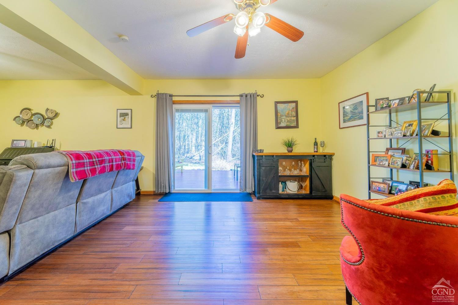 1831 Sleepy Hollow Road, Unit VV50 Athens, NY 12015 - Photo 36 of 42 a living room with furniture and a wooden floor