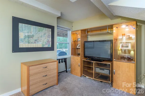 a room with furniture and flat screen tv