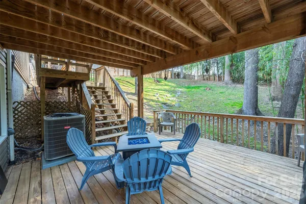 a view of balcony with furniture and wooden floor