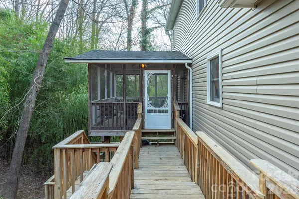 a view of a deck with wooden floor and fence