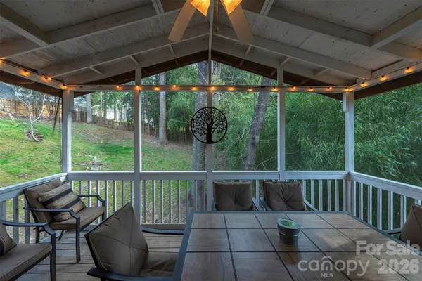 a view of a chairs and table in the patio