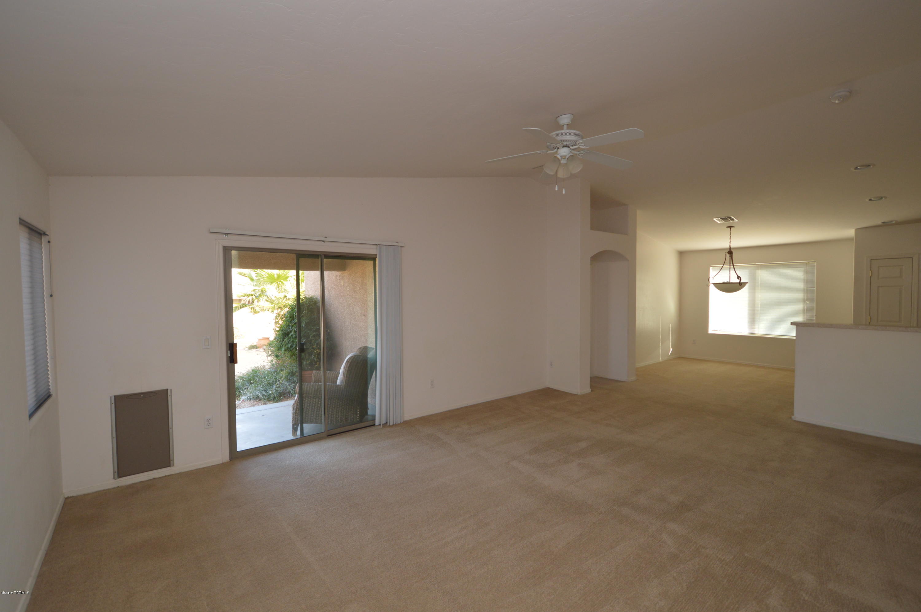 8396 West Benidorm Loop Tucson, AZ 85757 - Photo 3 of 13 a view of an empty room with a window