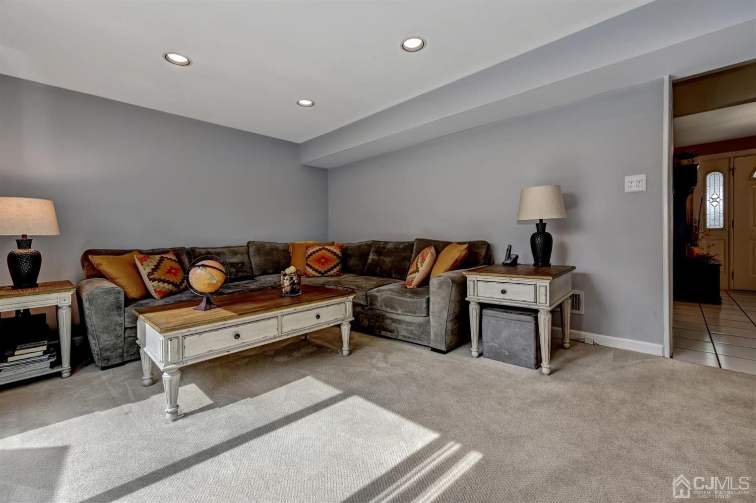 16 Chelsea Road Old Bridge, NJ 08857 - Photo 22 of 33 a living room with furniture and a couch