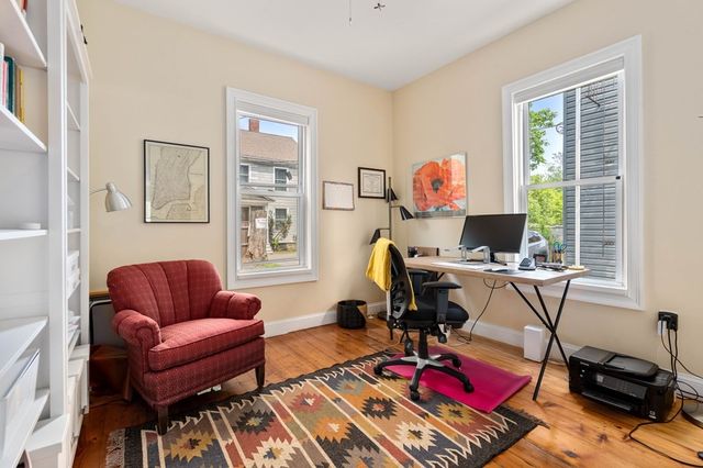 a view of car parked on the side of street