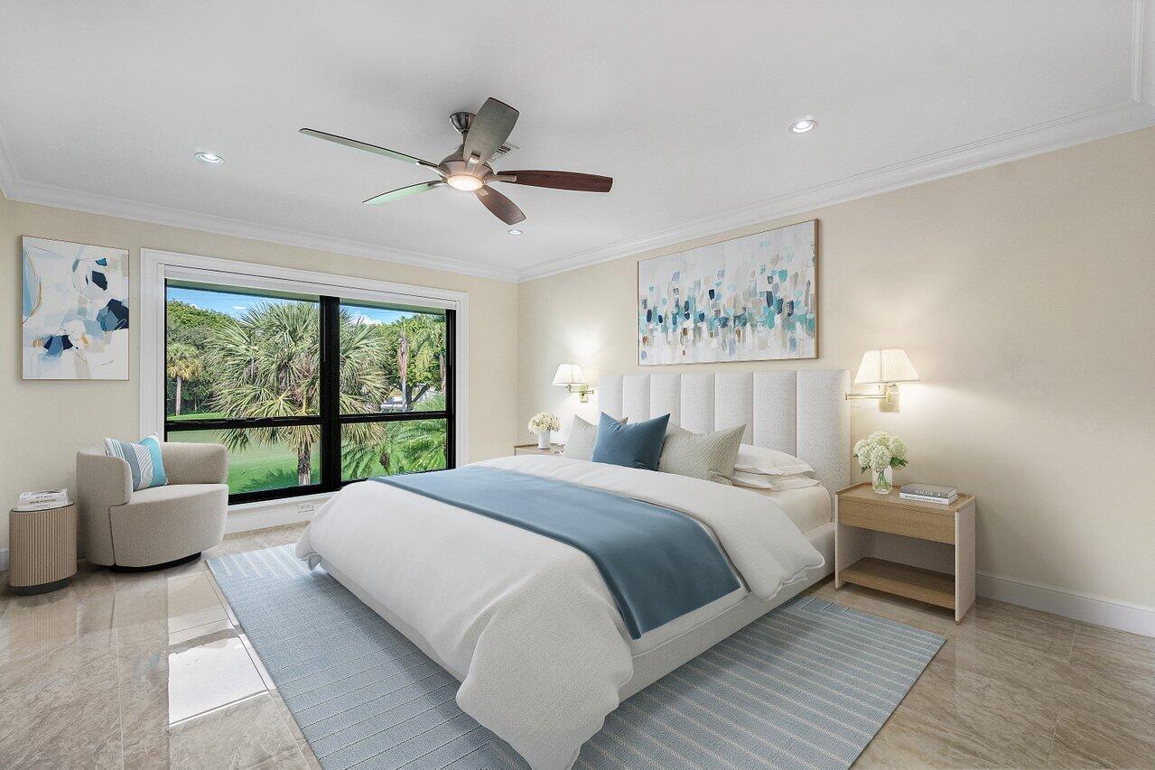 11110 Quail Covey Road, Unit MOCKINGBIRD Boynton Beach, FL 33436 - Photo 22 of 45 a bedroom with a large bed and a couch