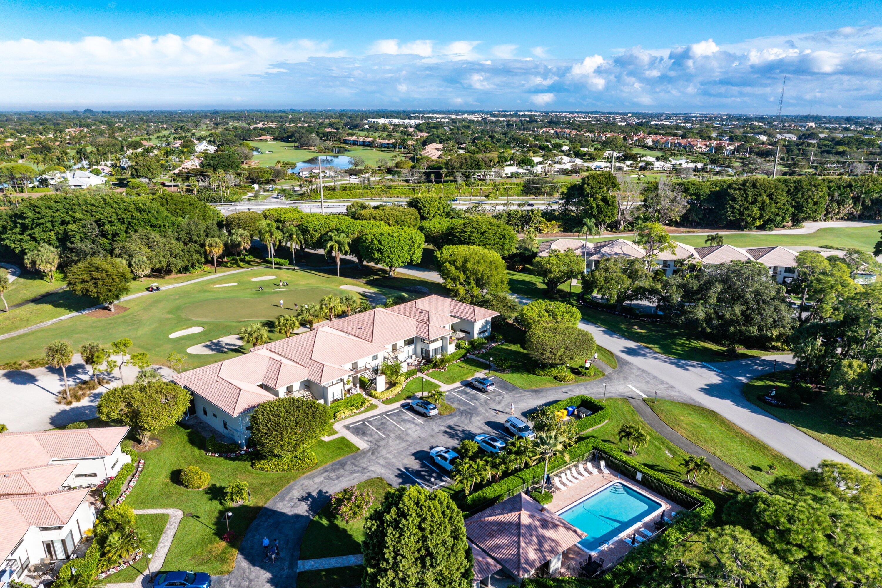 11110 Quail Covey Road, Unit MOCKINGBIRD Boynton Beach, FL 33436 - Photo 26 of 45 a view of a city with lots of green space
