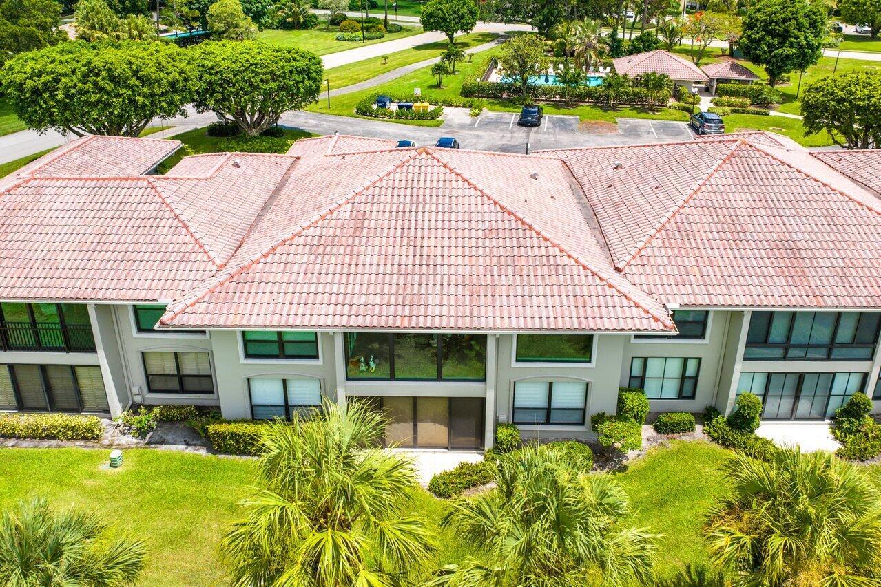 11110 Quail Covey Road, Unit MOCKINGBIRD Boynton Beach, FL 33436 - Photo 29 of 45 front view of a house with a yard