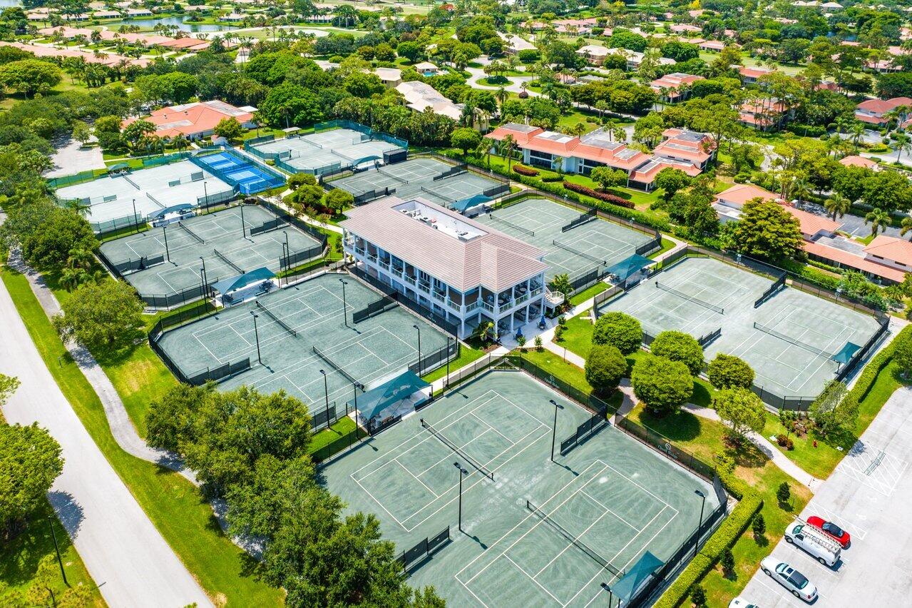 11110 Quail Covey Road, Unit MOCKINGBIRD Boynton Beach, FL 33436 - Photo 34 of 45 an aerial view of residential houses with outdoor space
