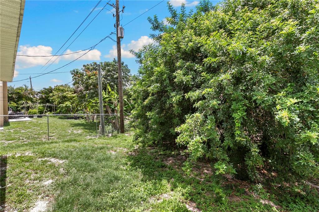 8264-8268 Matanzas Road Fort Myers, FL 33967 - Photo 29 of 33 a backyard of a house with lots of green space
