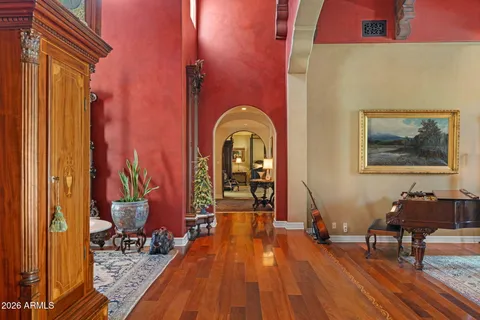 a view of living room with furniture and wooden floor