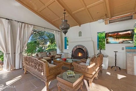 a living room with furniture a window and a fireplace