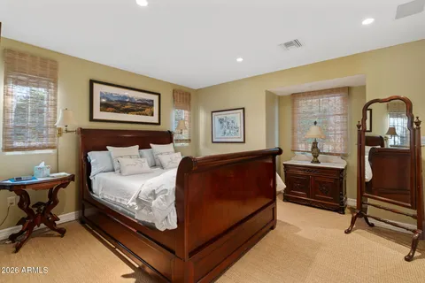 a bedroom with a bed and furniture