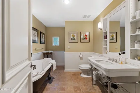 a bathroom with a sink a toilet and a bathtub