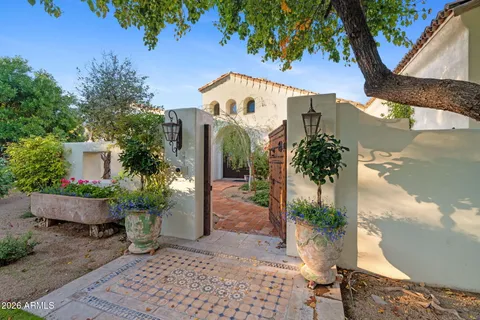 a picture of plants and trees with wooden fence