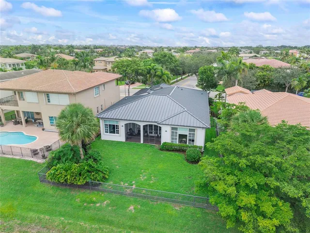 a view of a lake with houses in the back