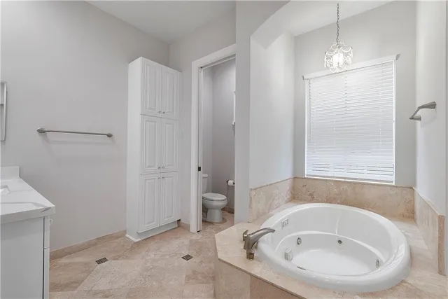 an aerial view of a house with a garden and lake view