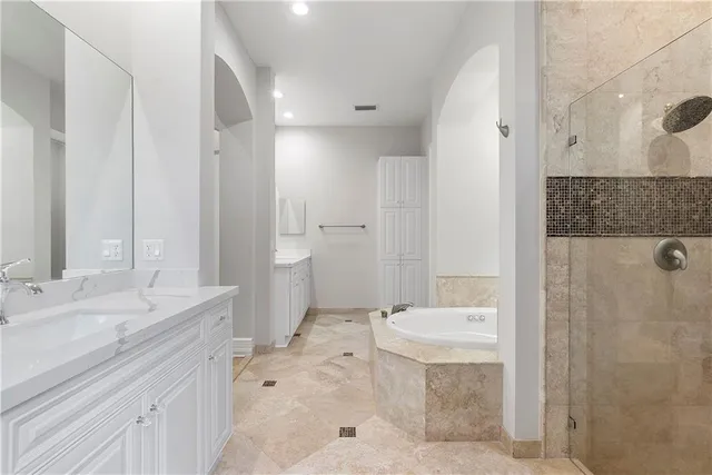 an aerial view of a house with a garden and lake view