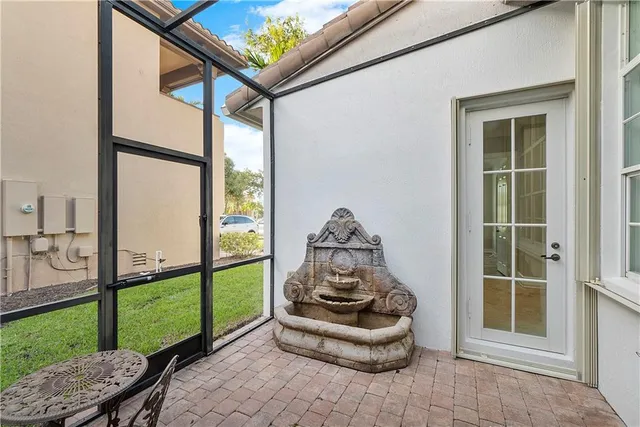 an aerial view of a residential houses with outdoor space and lake view