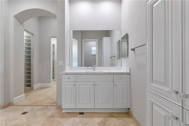 an aerial view of a house with garden space and lake view