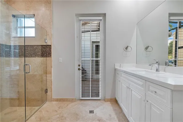 an aerial view of a house with yard and green space