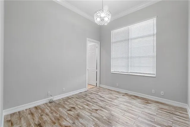 a front view of a house with a garden and plants