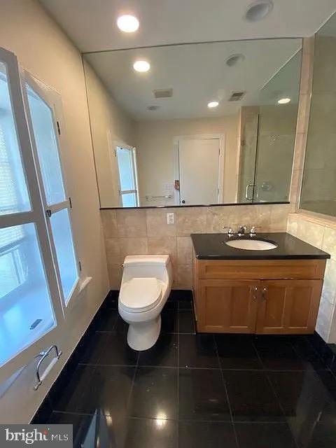 1203 31st Street Northwest, Unit 1 Washington, DC 20007 - Photo 12 of 14 Modern bathroom with sleek finishes.