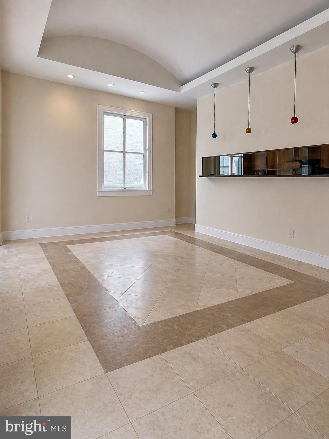 1203 31st Street Northwest, Unit 1 Washington, DC 20007 - Photo 6 of 14 Spacious room with elegant tile design.