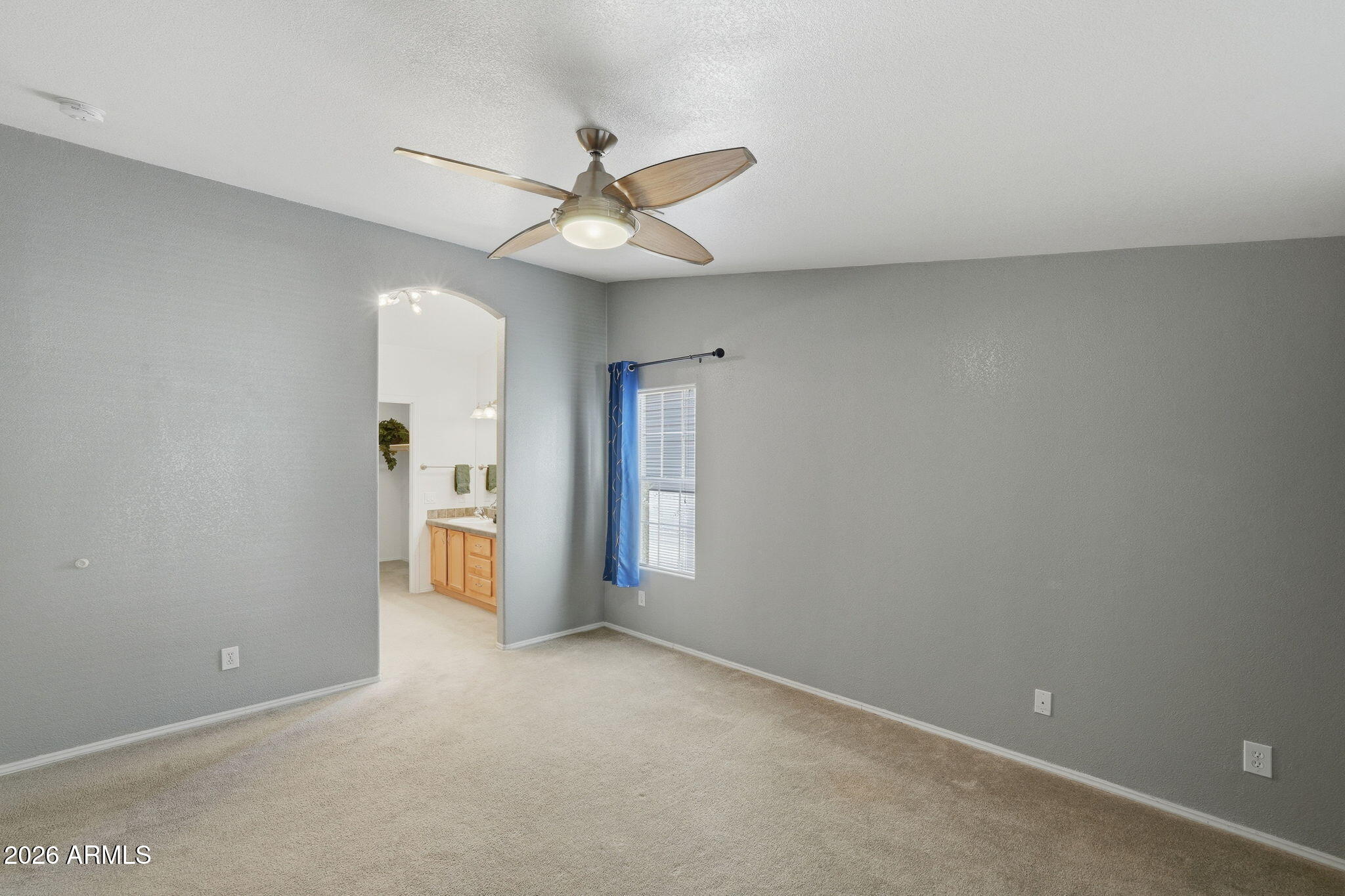 3301 South Goldfield Road, Unit 1015 Apache Junction, AZ 85119 - Photo 15 of 34 an empty room with closet and a ceiling fan