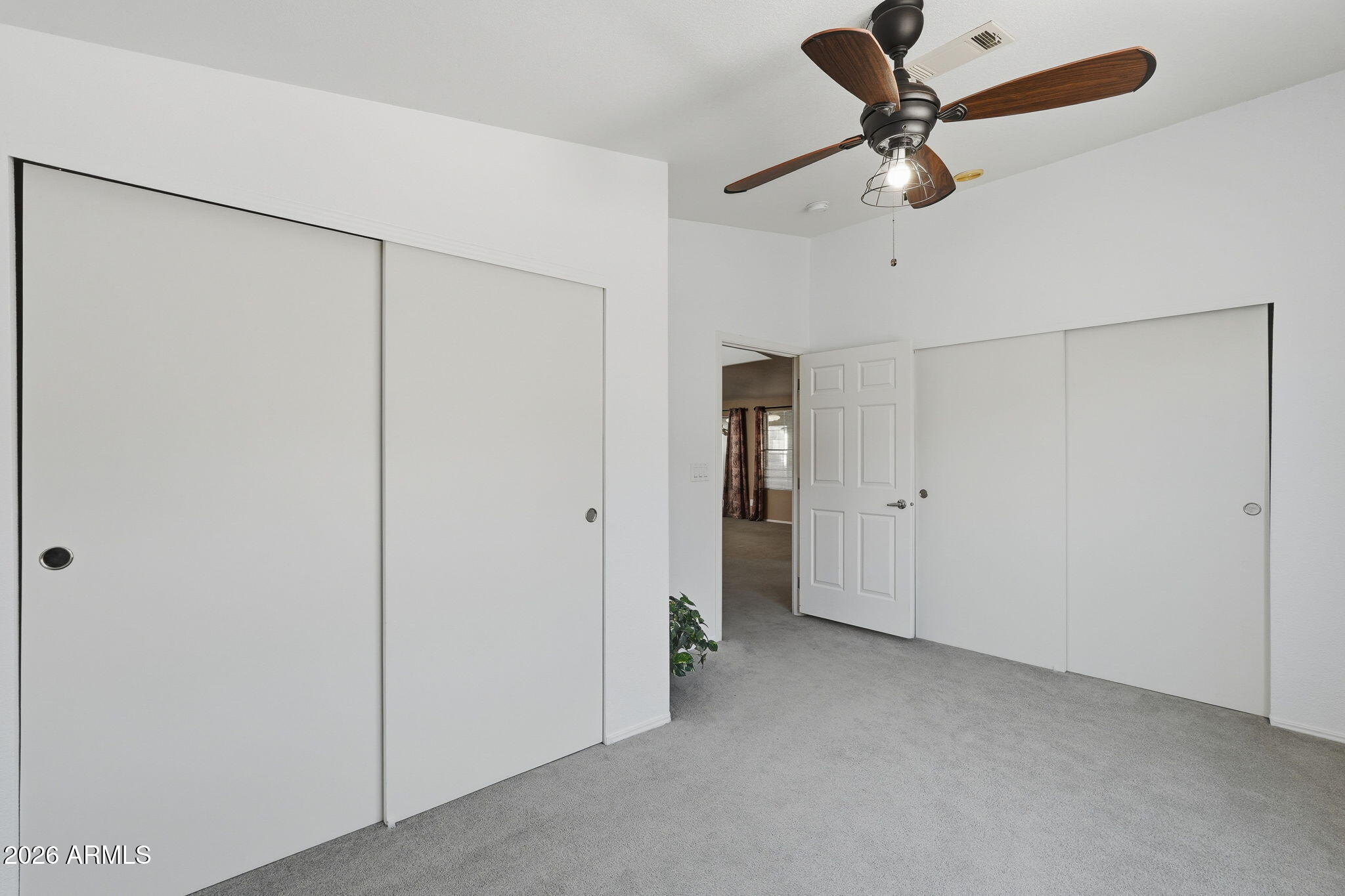 3301 South Goldfield Road, Unit 1015 Apache Junction, AZ 85119 - Photo 20 of 34 a view of a livingroom with a ceiling fan and entryway