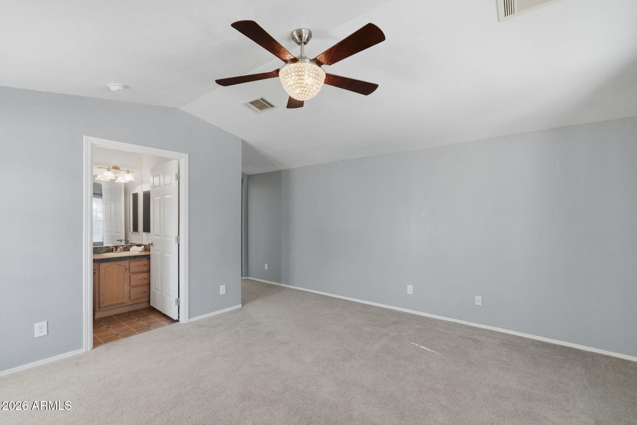 3301 South Goldfield Road, Unit 1015 Apache Junction, AZ 85119 - Photo 22 of 34 an empty room with closet and ceiling fan