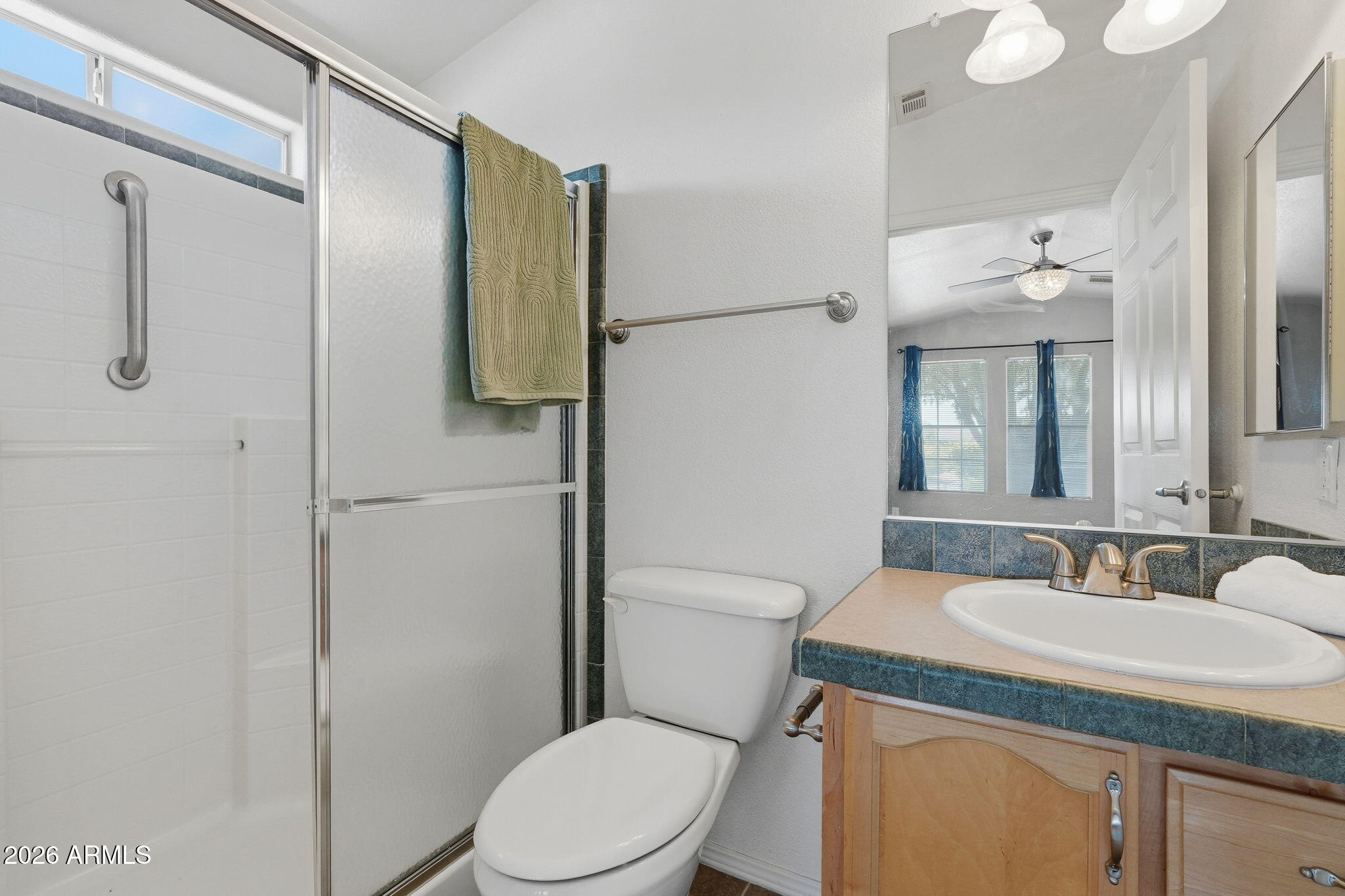 3301 South Goldfield Road, Unit 1015 Apache Junction, AZ 85119 - Photo 26 of 34 a bathroom with a granite countertop sink toilet and shower