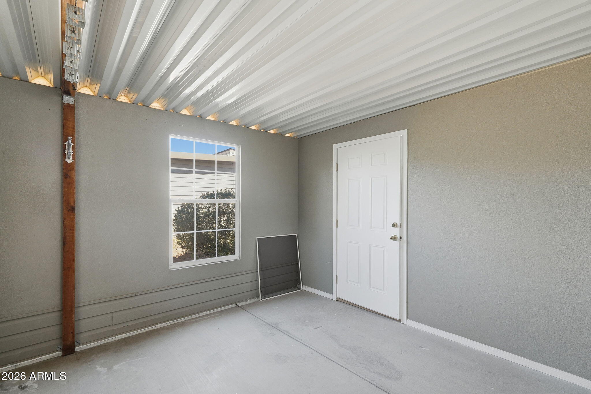 3301 South Goldfield Road, Unit 1015 Apache Junction, AZ 85119 - Photo 29 of 34 an empty room with windows