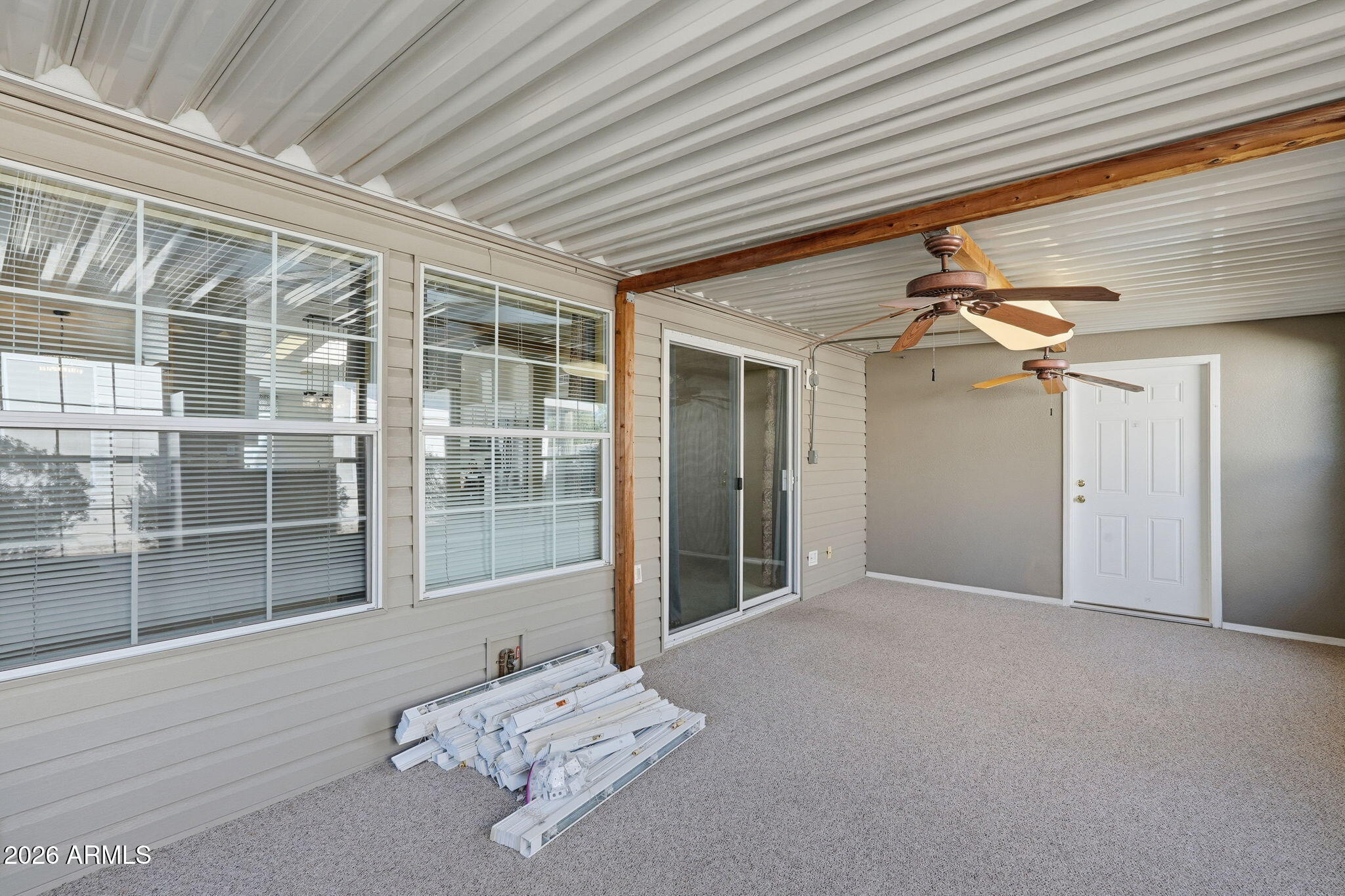 3301 South Goldfield Road, Unit 1015 Apache Junction, AZ 85119 - Photo 30 of 34 a view of a livingroom with a ceiling fan and window