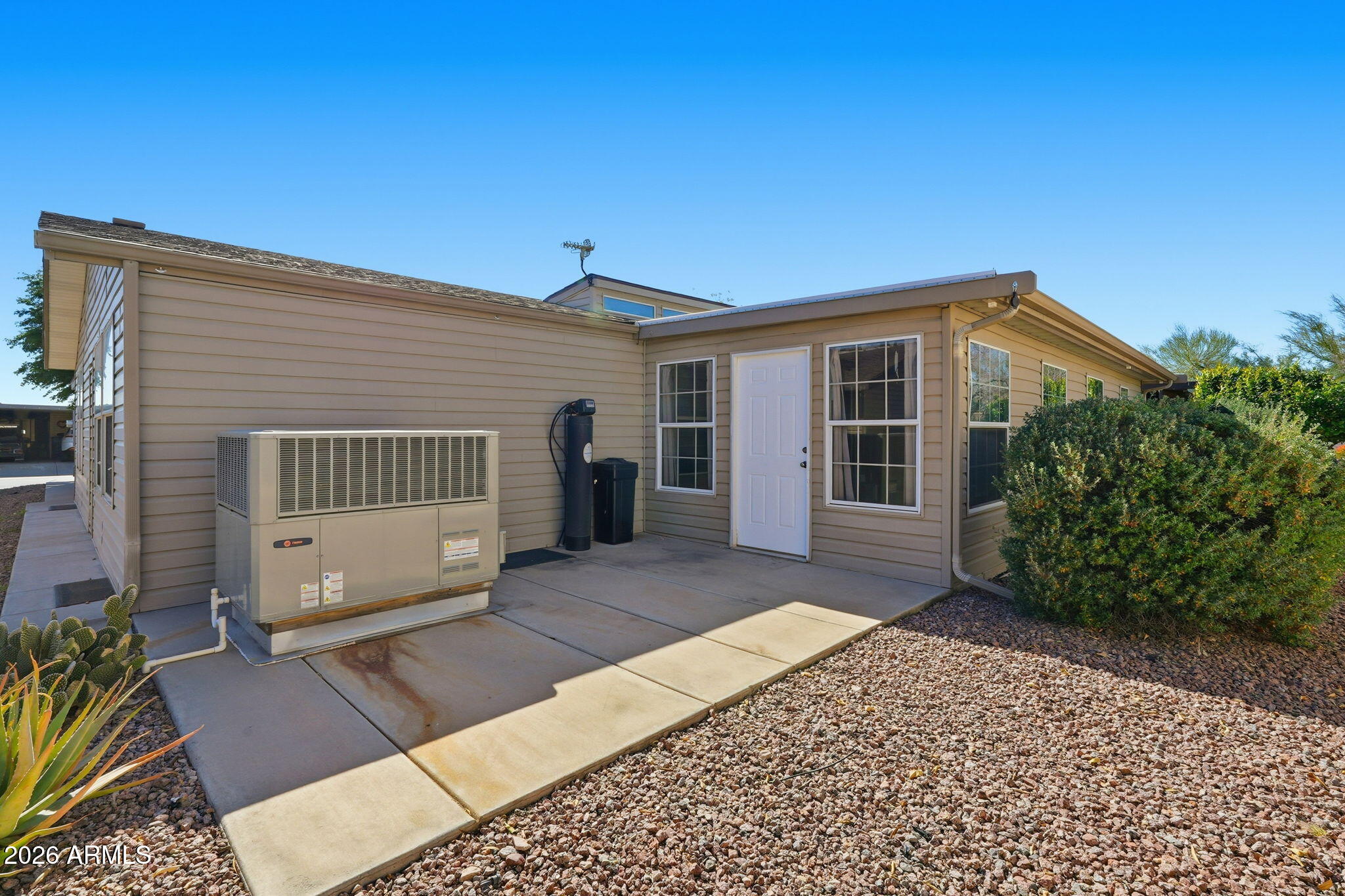 3301 South Goldfield Road, Unit 1015 Apache Junction, AZ 85119 - Photo 32 of 34 a view of a house with a yard