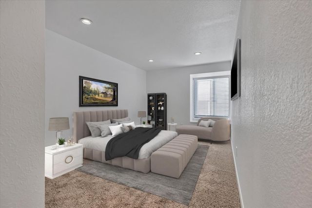 a bedroom with a bed and a couch