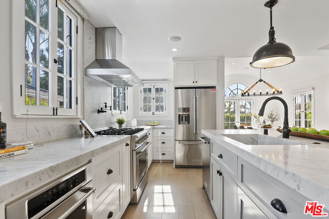 6507 West Olympic Boulevard Los Angeles, CA 90048 - Photo 18 of 50 a kitchen with a sink stove and refrigerator