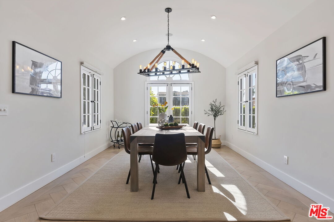 6507 West Olympic Boulevard Los Angeles, CA 90048 - Photo 20 of 50 a dining room with furniture a rug and a chandelier