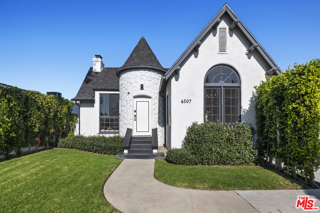 6507 West Olympic Boulevard Los Angeles, CA 90048 - Photo 2 of 50 a front view of a house with a yard