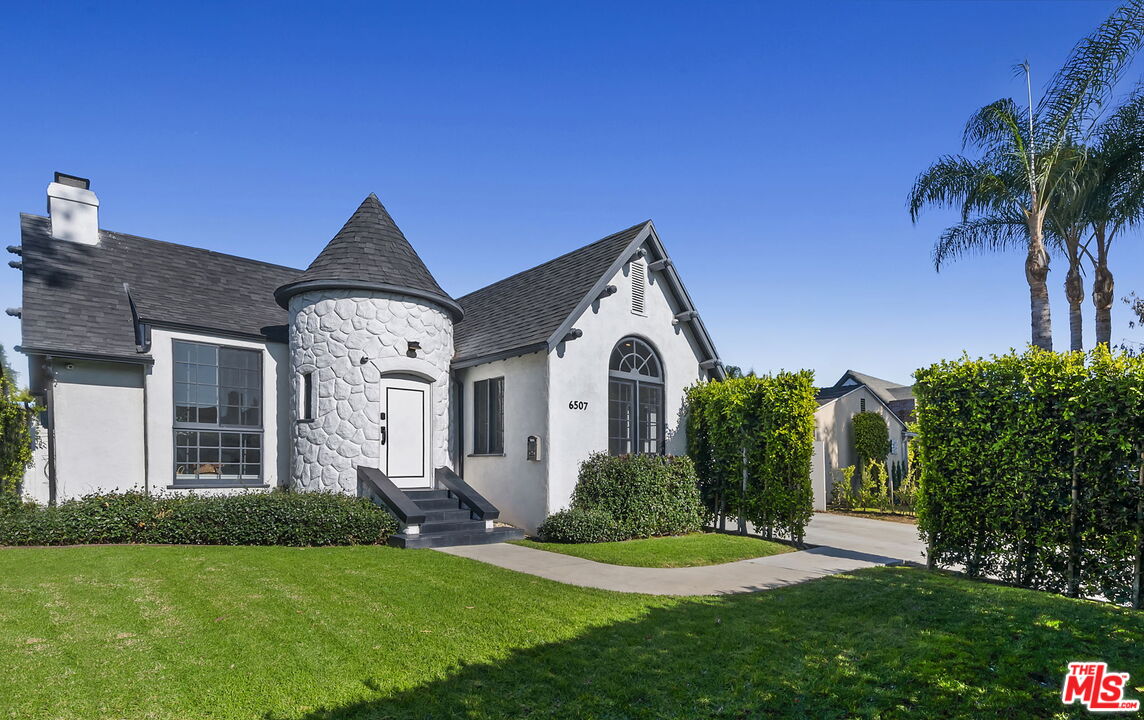 6507 West Olympic Boulevard Los Angeles, CA 90048 - Photo 3 of 50 a front view of a house with a yard