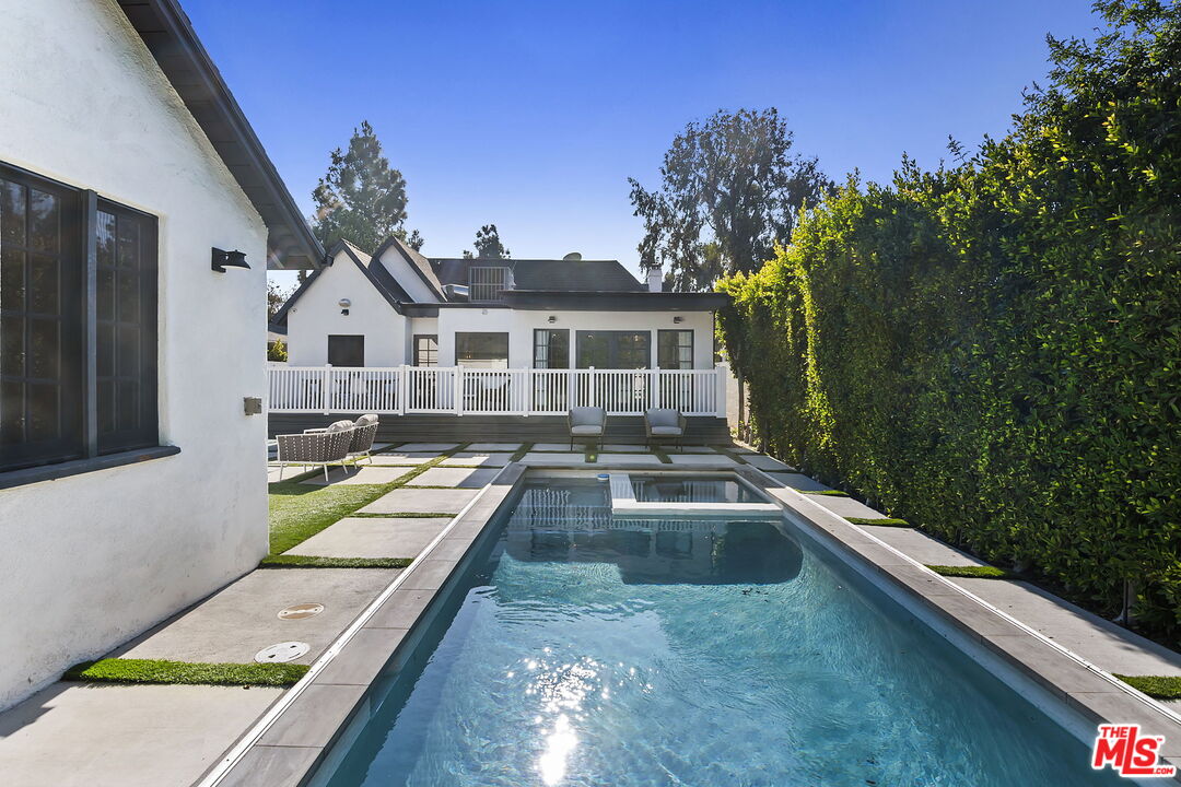6507 West Olympic Boulevard Los Angeles, CA 90048 - Photo 43 of 50 a view of a house with pool and chairs