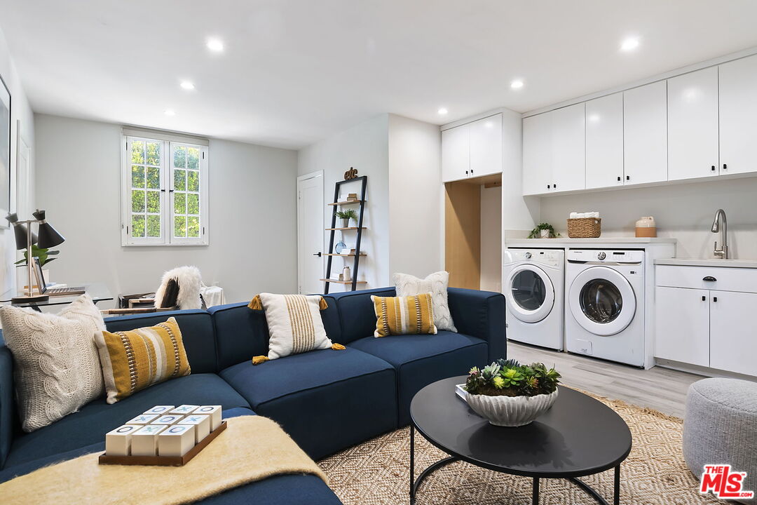6507 West Olympic Boulevard Los Angeles, CA 90048 - Photo 48 of 50 a living room with furniture and a wooden floor